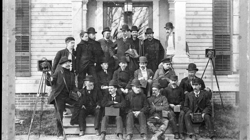 Photograph by Shelley Farkas | Waterbury Photographic Society on the steps with their cameras, c. 1890, Negative, Mattatuck Museum Archives