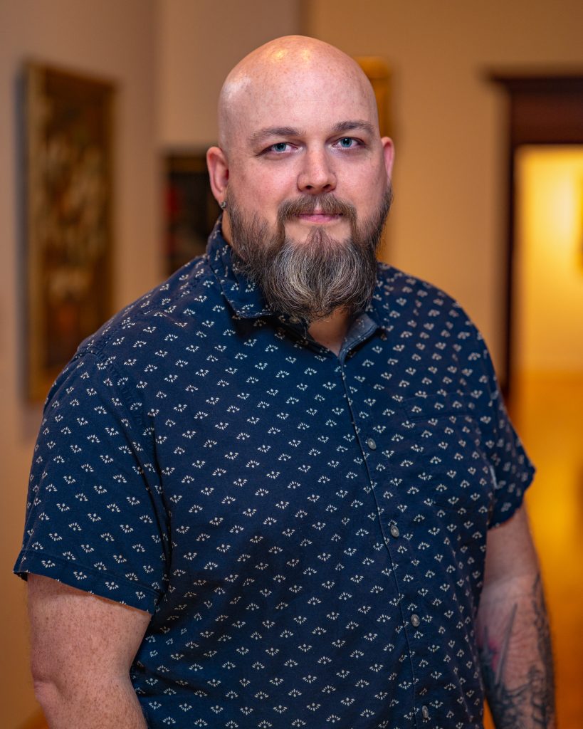 Colin Devore in a blue shirt