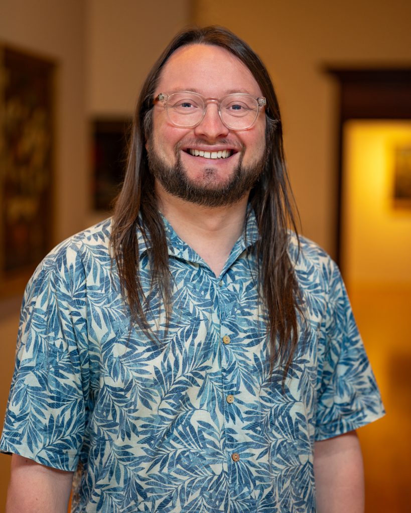 Jason Foberg in a hawaian shirt wearing glasses
