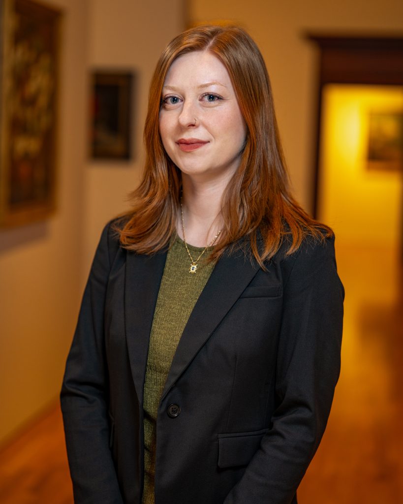 Maddie Stenson in a green shirt with black jacket