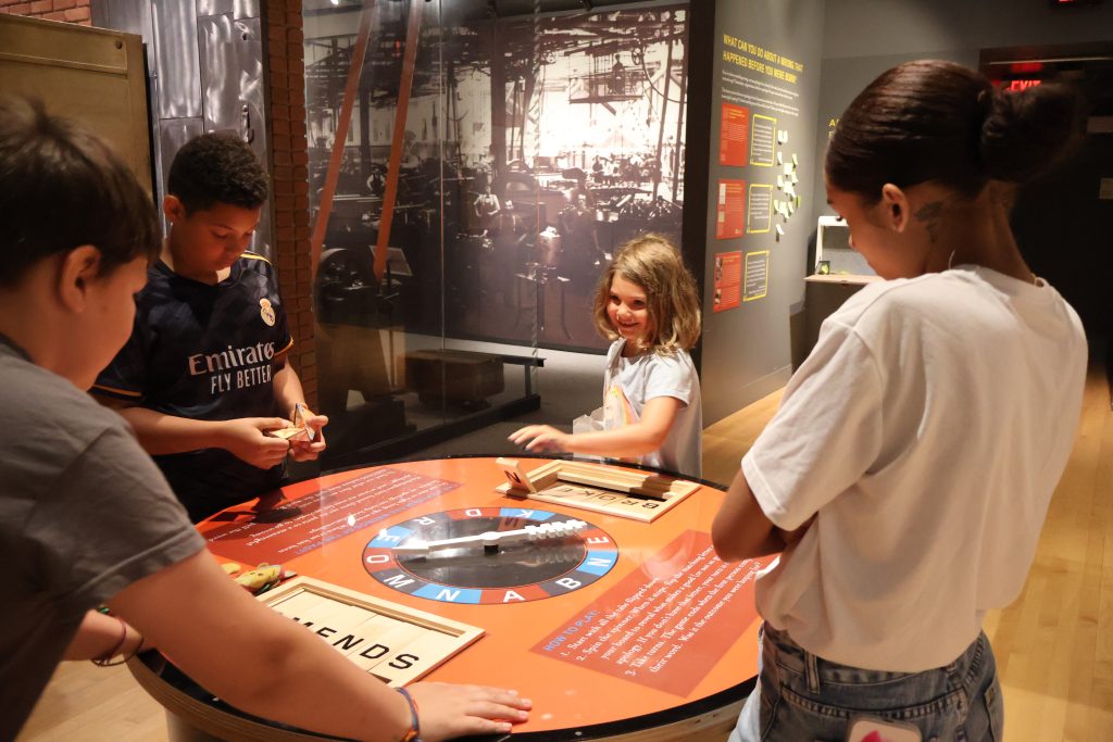 children using interactive element in the history gallery