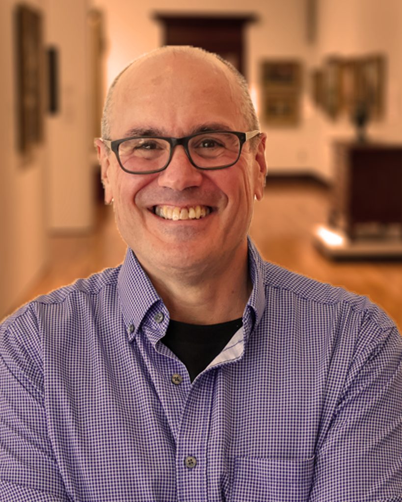 Marty in button up shirt with glasses